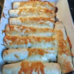 Beef & Bean Burritos in white casserole dish