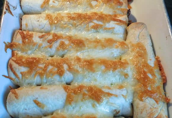 Beef & Bean Burritos in white casserole dish