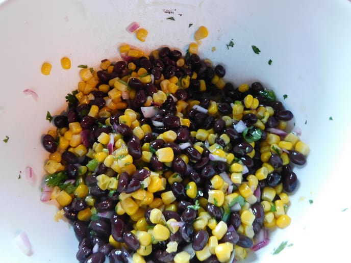 White bowl with corn, black beans 