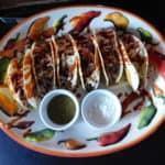 Steakhouse Tacos on a platter on a black counter