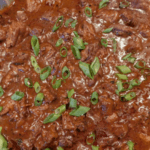 Rich beef stew in deep red sauce