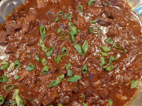 Rich beef stew in deep red sauce