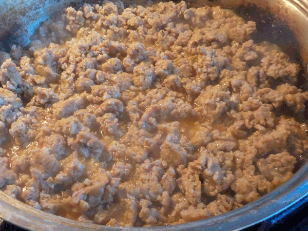 crumbled cooking sausage in a skillet