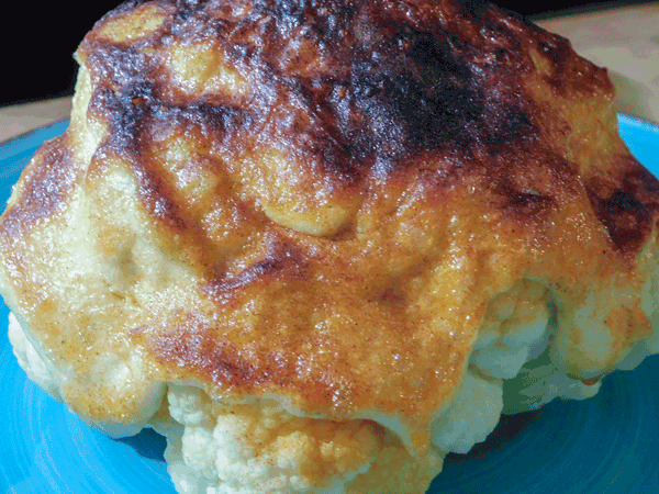 Baked hjead of cauliflower with mayo dressing