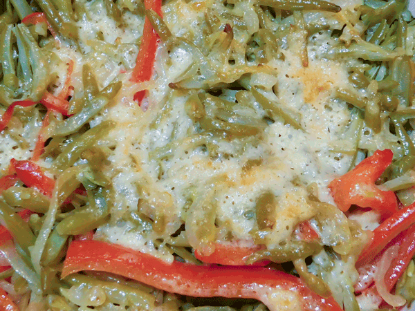 melted parmesan cheese ove green beans onions and red peppers