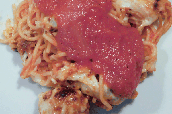 Baked spaghetti and meatballs with cheese and pasta sauce