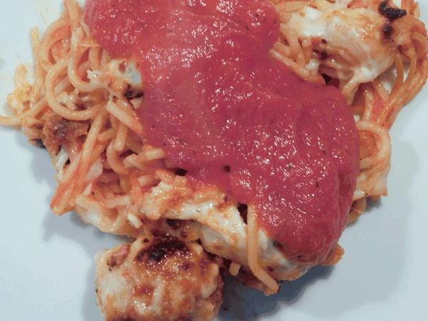 Baked spaghetti and meatballs with cheese and pasta sauce