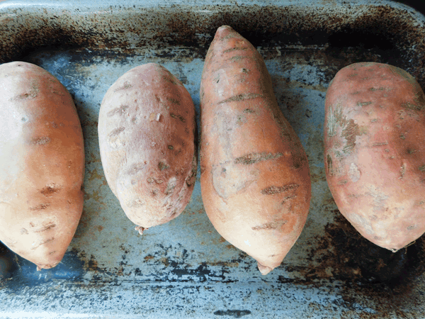 4 Medium sweet potatoes on a baking dish
