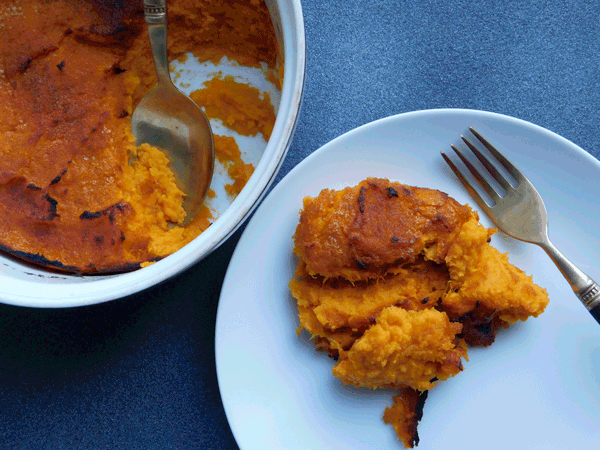 Sweet potatoes in white round casserole and on white plate with fork