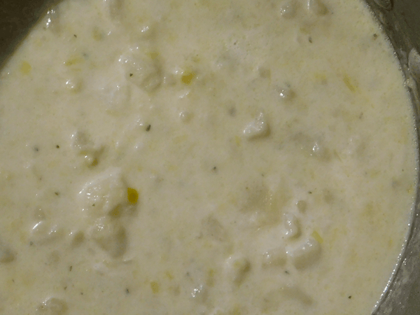 Chunky cooked potato and leek soup in pot