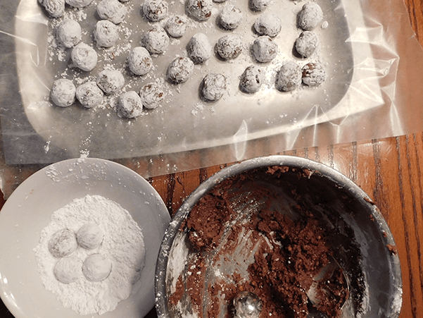 Cookies in process on wooden table