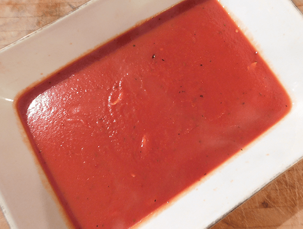 Tomato sauce in a white casserole dish