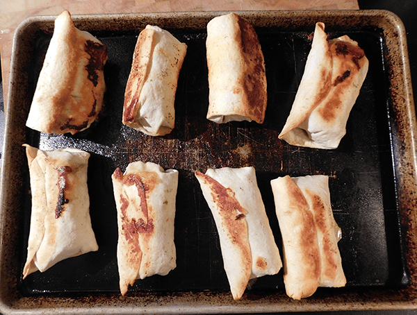 Baked Chicken Chimichangas on a baking sheet