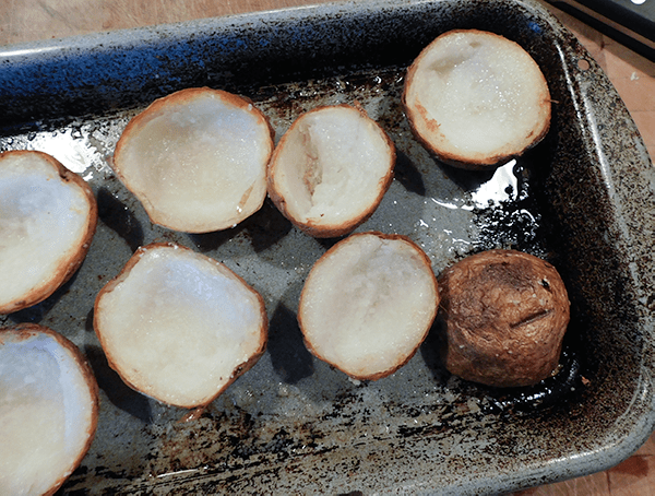 Crisoy on outside potatoes on baking sheet