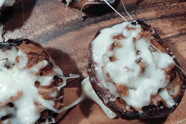 Closeup of gooey and delicious looking brisket potato skins