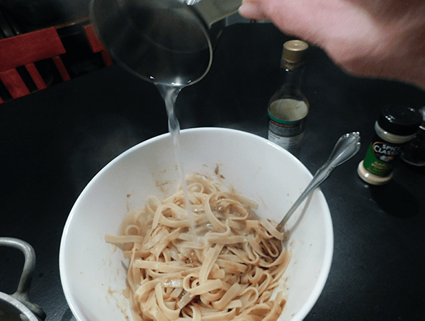 Adding water to asian noodles prior to mixing up