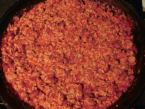 Cooked sausage skillet dinner in cast iron skillet