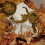 Prepred Tex-Mex sausage skillet with sour cream and jalapenos