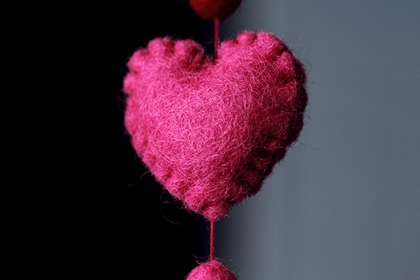 Pink Felt heart with gray background