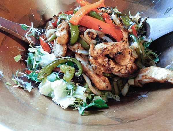 Chicken Fajita Sheet Pan Salad in a wooden bowl