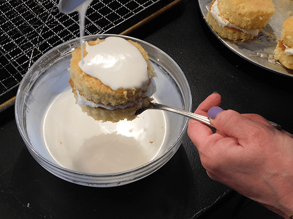 Coating Zebra Cake over bowl