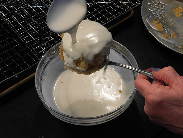 Coating Zebra Cake over bowl
