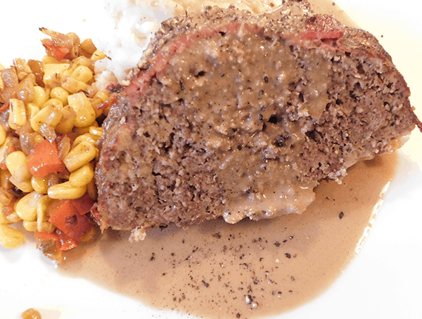 Mealtoaf and corn on a serving plate