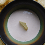 Horseradish Dip in a multicolored bowl with chips