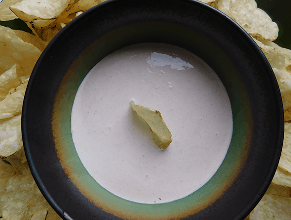 Horseradish Dip in a multicolored bowl with chips
