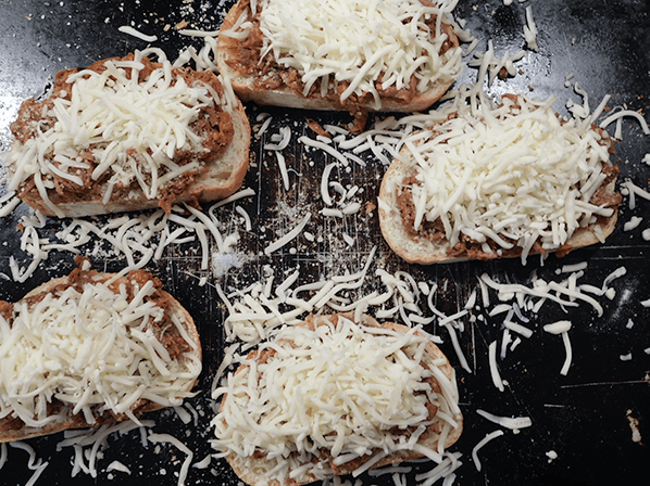 Italian bread mounded with beef and mozzarella for italian beef sandwiches