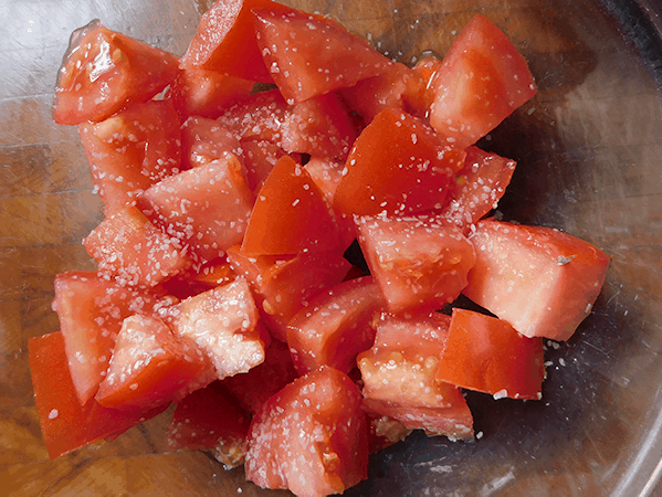 Chopped tomatoes in a clear bowl