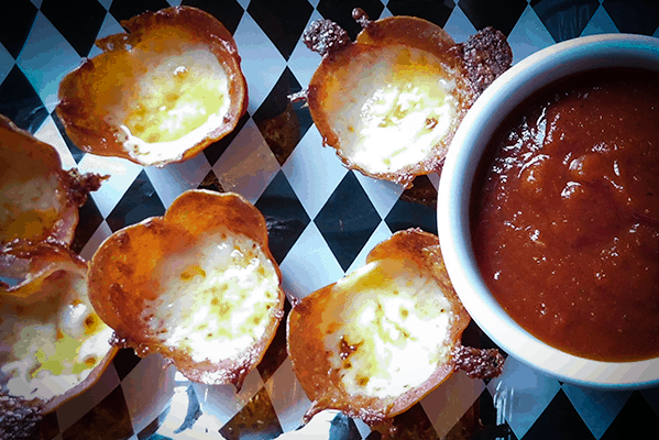 Close up of Pepperoni Cheese Bites and marinara sauce