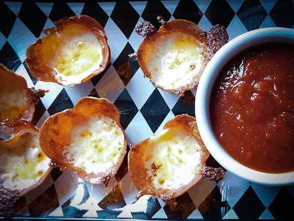 Close up of Pepperoni Cheese Bites and marinara sauce