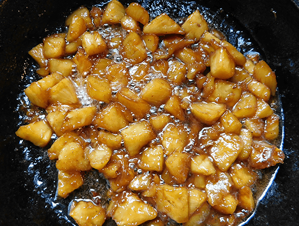 Pineapple Butter Rum Sundae topping in a cast iron skillet