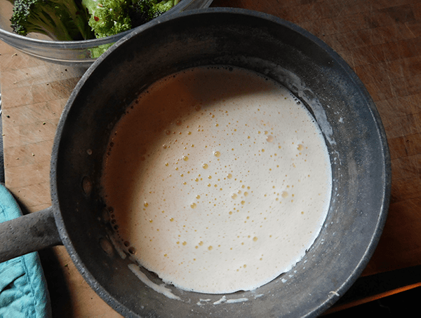 Melted butter, garlic and heavy cream in a medium saucepan