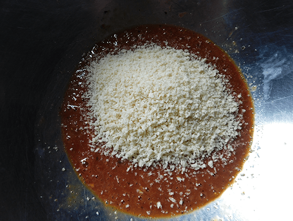 Eggs and ketchup mixed with breadcrumbs for Meatloaf Meatballs