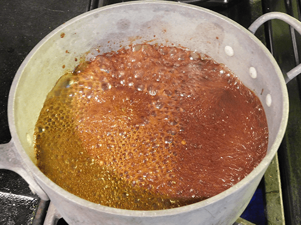 sian brown sweet and savory sauce cooking on stove