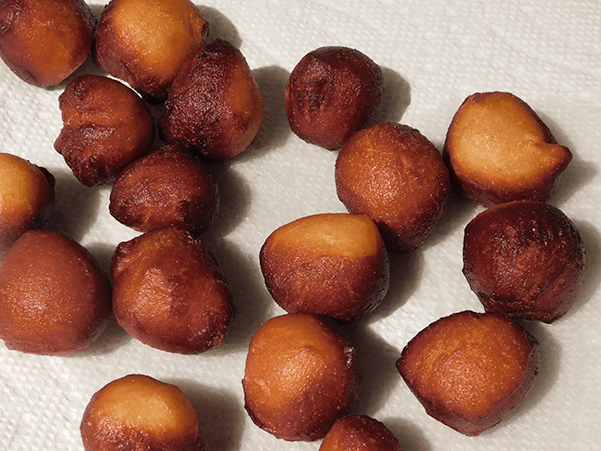 Donut Holes just out of the fryer on paper towels