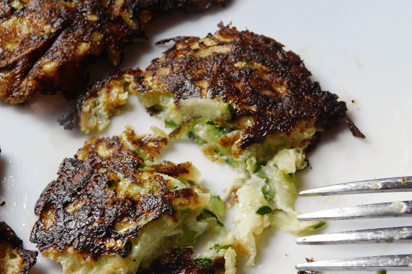 Zucchini Pancakes cut on a white plate