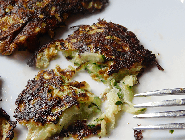 Zucchini Pancakes cut on a white plate