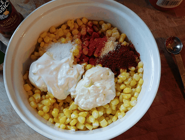Corn and ingredients in a casserole dish