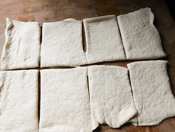 Pizza Dough rolled out and cut into 8 pieces