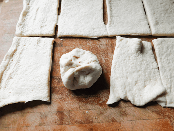 Pizza dough rolled around pepperoni