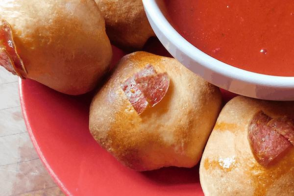 Closeup of Pepperoni Balls on a red plate
