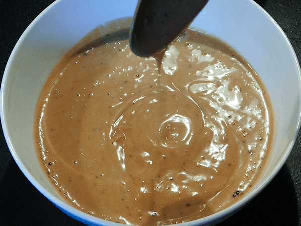 Peanut Sauce dribbling into bowl
