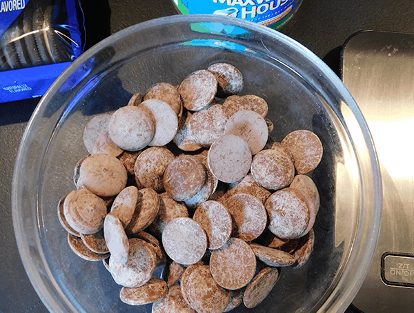 Chocolate melts in bowl next to scale