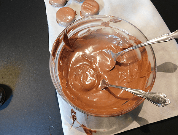 Dipping oreos in chocolate