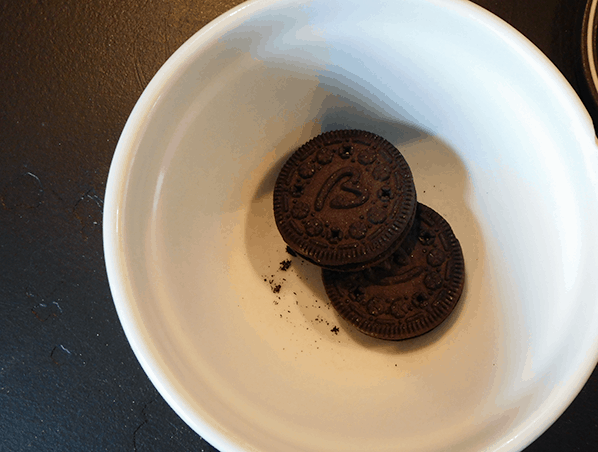 Oreos in a glass bowl ready to be crushed