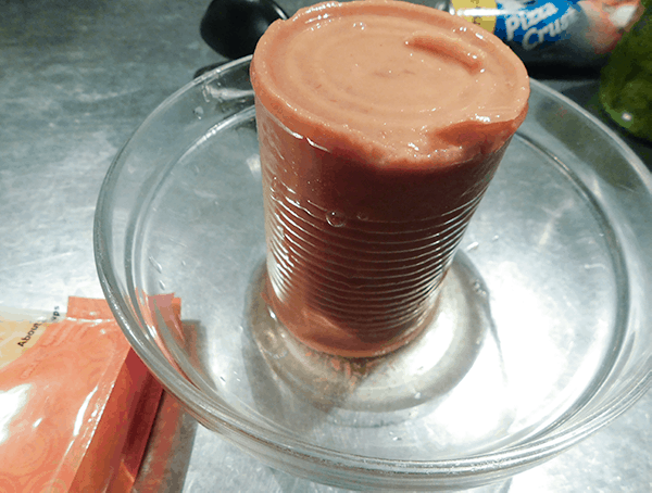 Refried beans fresh from the can in a bowl