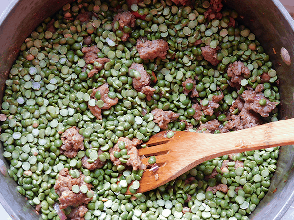 Sausage and split peas in a soup pot